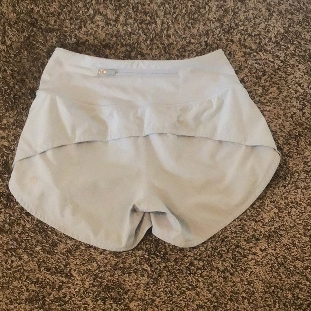 The brand of these shorts are Lululemon. The color is blue.